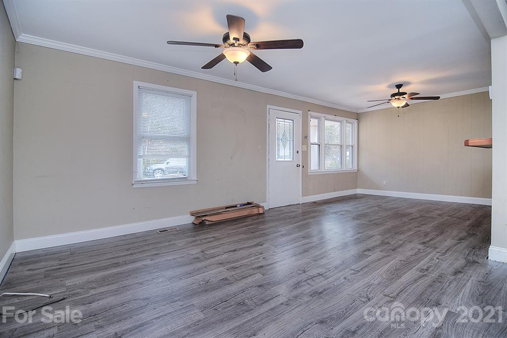 1100 Culp Street Lancaster, SC 29720 - Photo 10 of 30 a view of room with window ceiling fan and hardwood floor