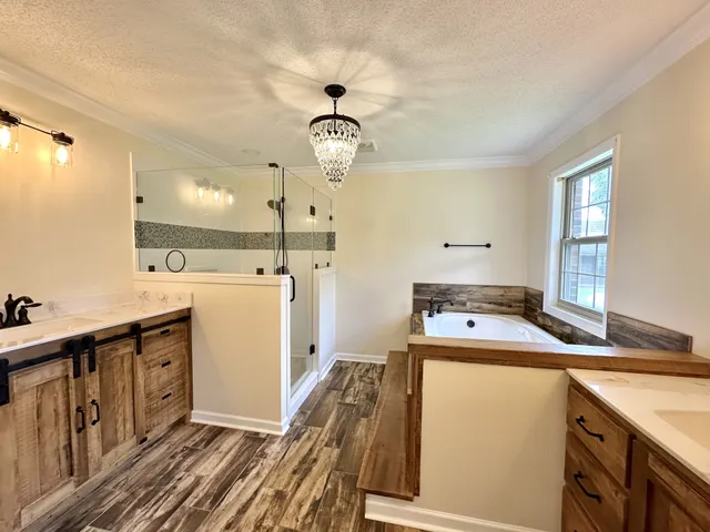 a room with a sink a stove and cabinets