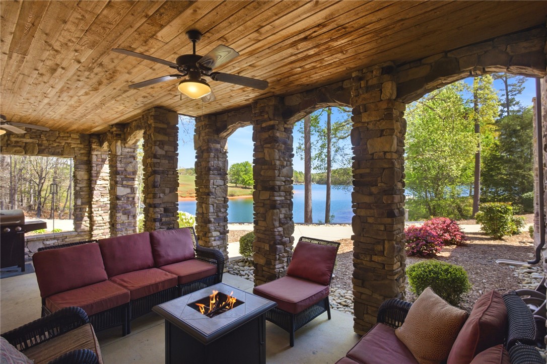 578 Sunset Point Drive West Union, SC 29696 - Photo 38 of 46 This inviting covered patio offers captivating lake views, perfect for visiting with friends and guests!