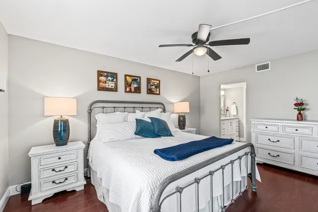 a bedroom with a bed and a dresser