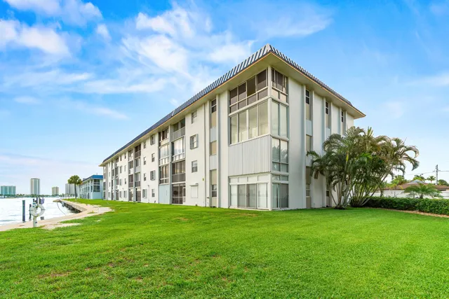 a swimming pool with outdoor seating and garden