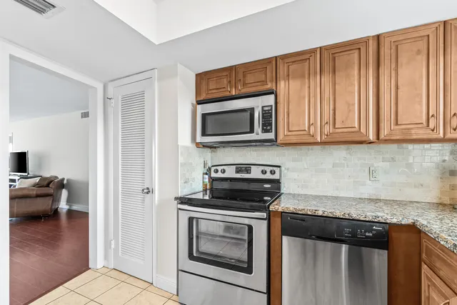 a kitchen with a stove and a microwave