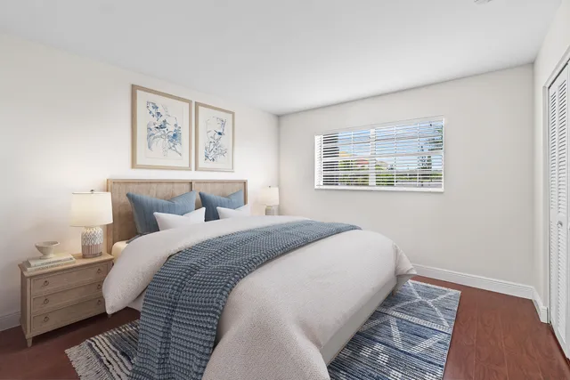 a bedroom with bed and window