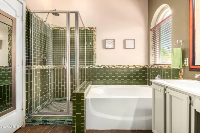 a bathroom with a bathtub and a shower