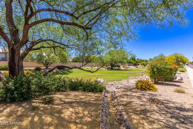 a view of swimming pool with a yard