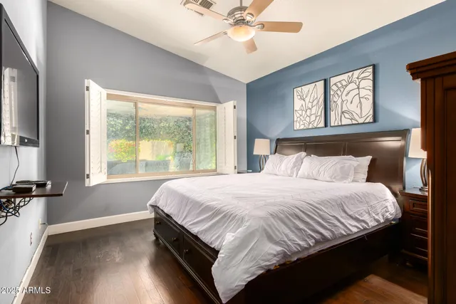 a bedroom with a bed and window