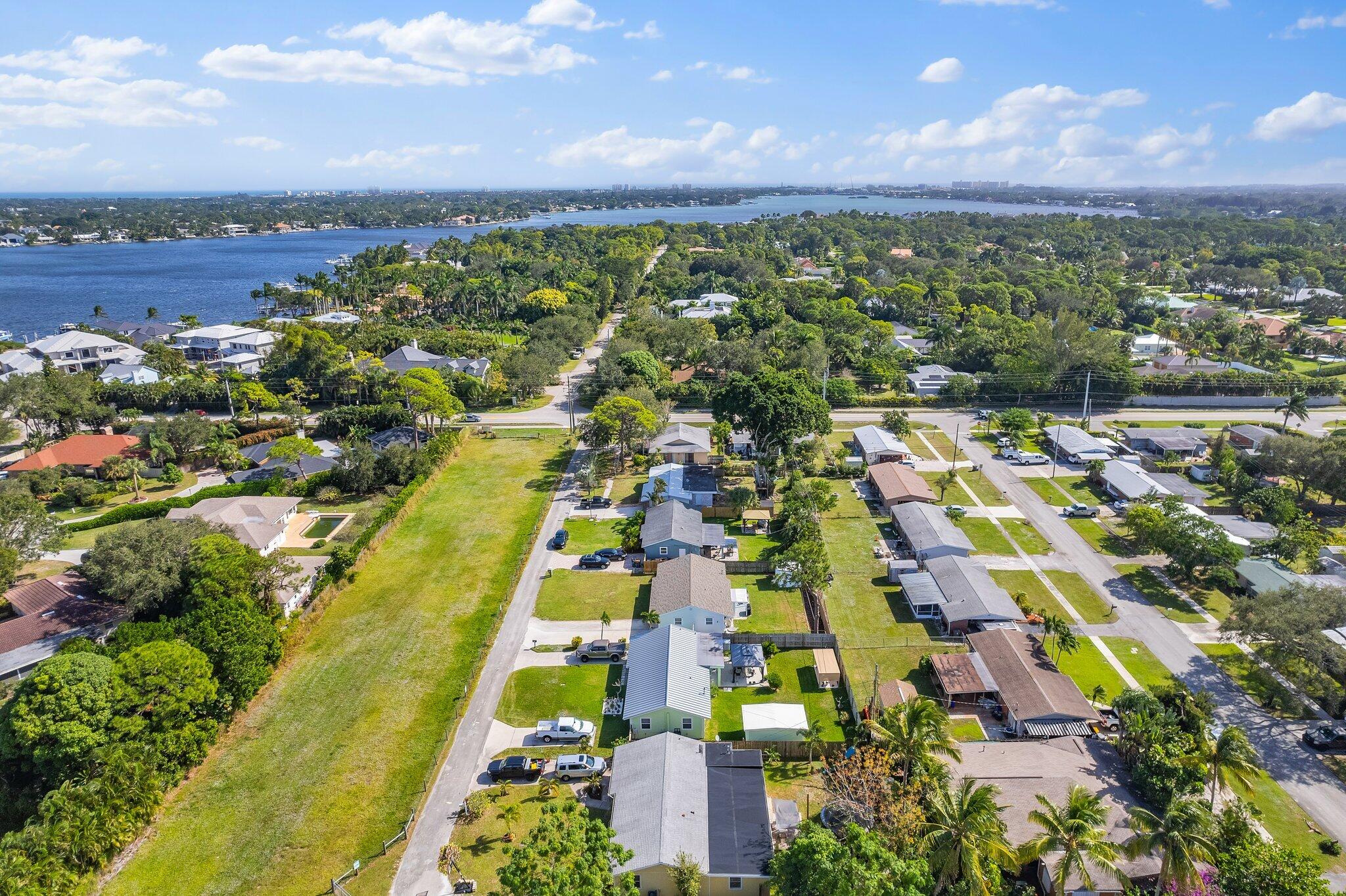 5810 Tucker Road Jupiter, FL 33458 - Photo 36 of 51 an aerial view of residential houses with outdoor space