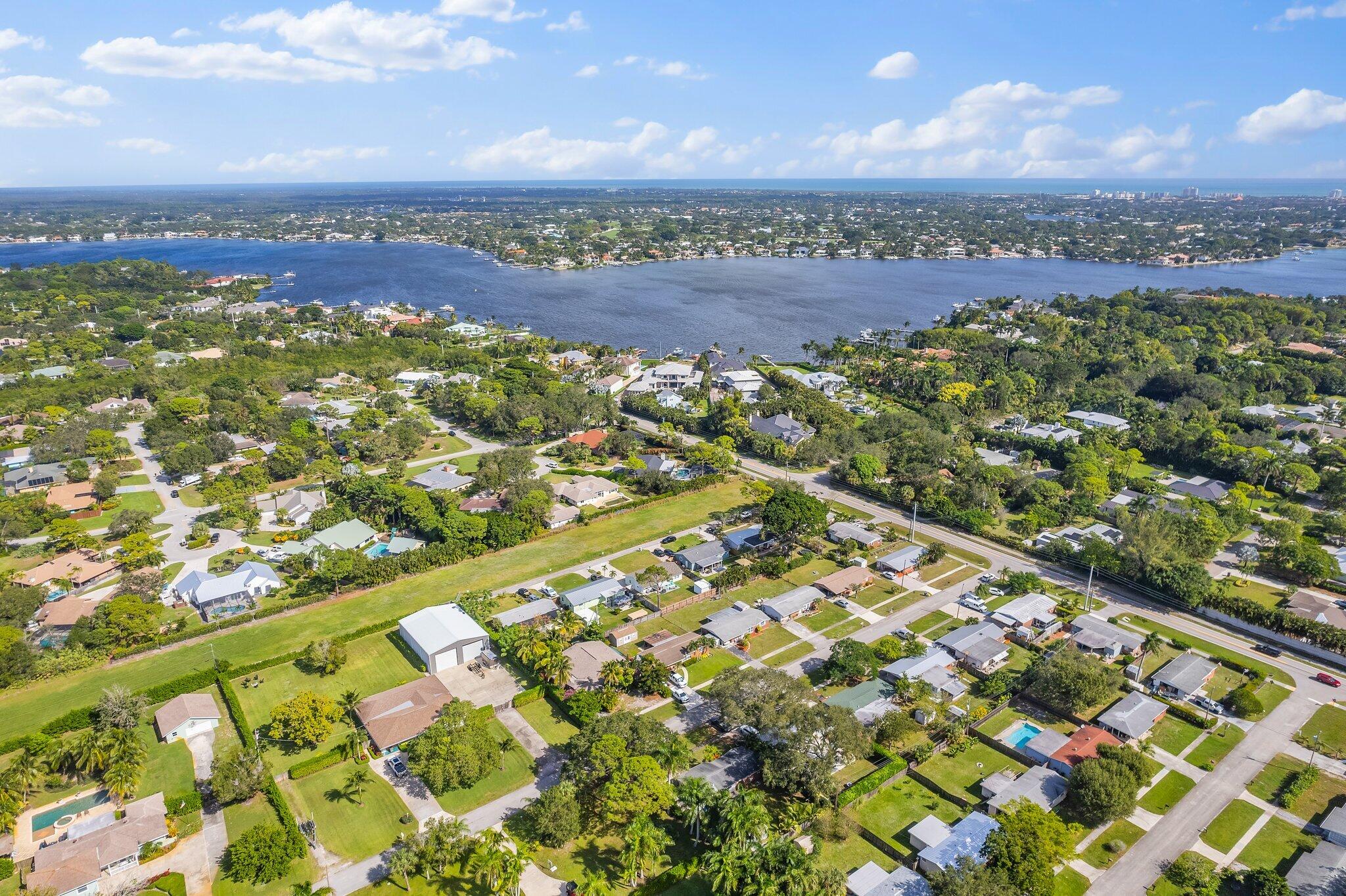 5810 Tucker Road Jupiter, FL 33458 - Photo 42 of 51 an aerial view of residential houses with outdoor space