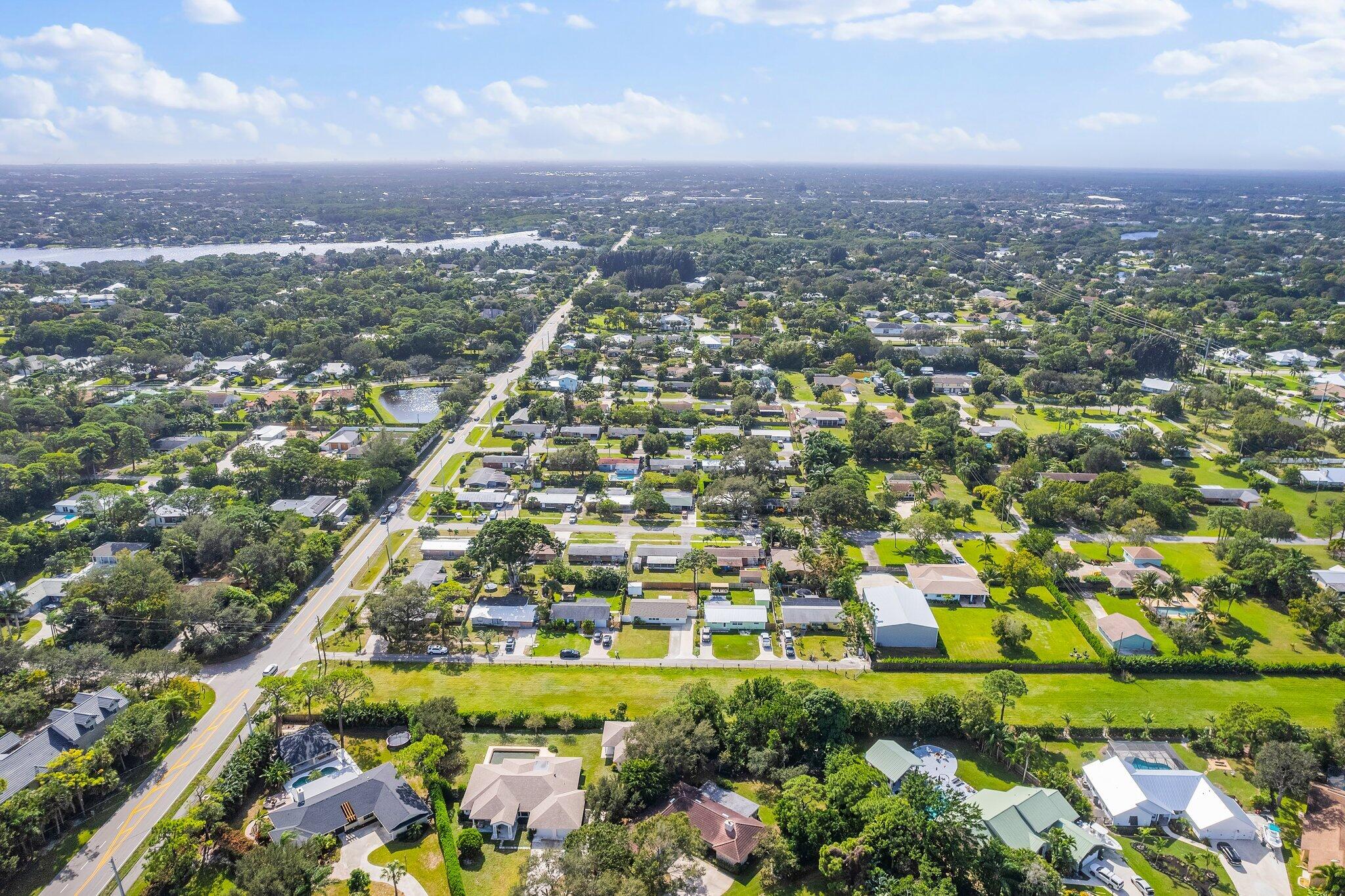 5810 Tucker Road Jupiter, FL 33458 - Photo 45 of 51 an aerial view of residential building and green space