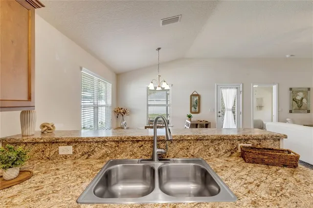 a kitchen with sink and window