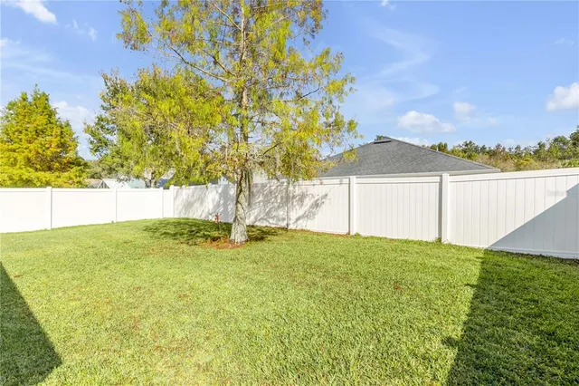 a view of a yard with an outdoor space