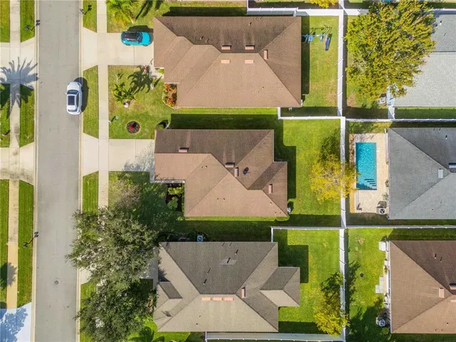an aerial view of a house with a garden