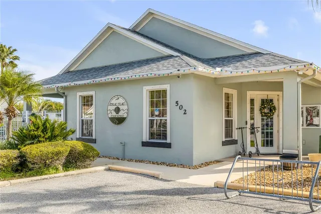 a view of a swimming pool with outdoor seating