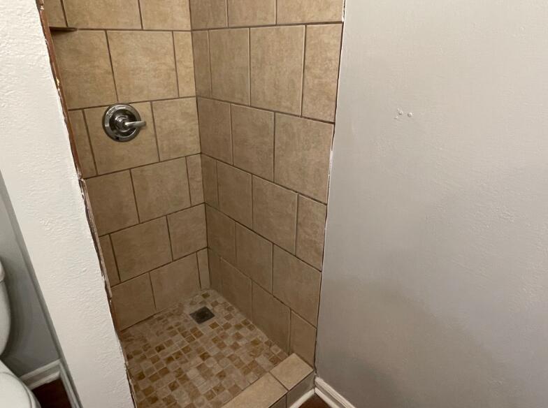 2607 27th Street Lubbock, TX 79410 - Photo 10 of 13 a bathroom with a shower