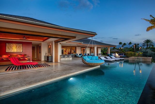 a view of swimming pool with outdoor seating and lake view