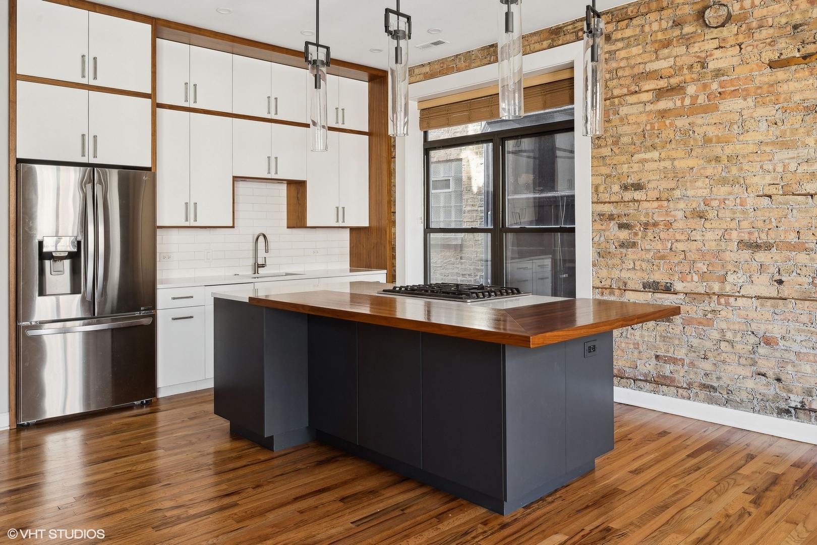 717 West Briar Place, Unit 2W Chicago, IL 60657 - Photo 12 of 26 a kitchen with stainless steel appliances granite countertop a refrigerator and a sink