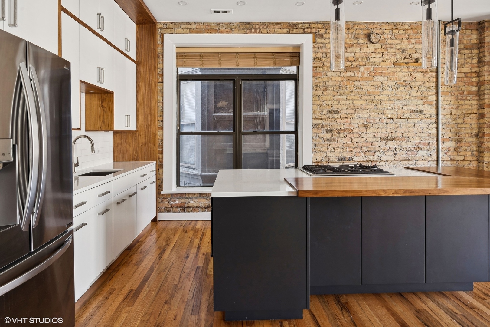 717 West Briar Place, Unit 2W Chicago, IL 60657 - Photo 14 of 26 a kitchen with stainless steel appliances a sink stove and refrigerator