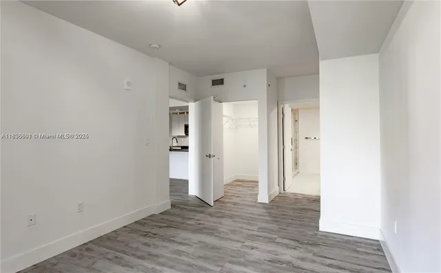 a view of an empty room with a window