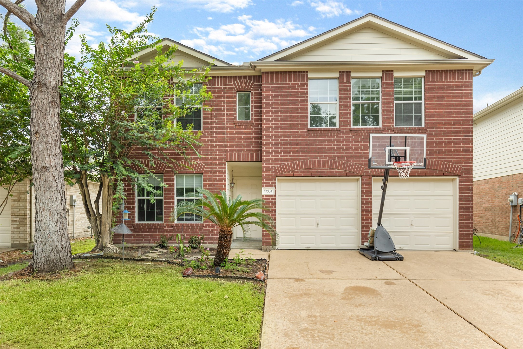 17334 Turquoise Stream Drive Houston, TX 77095 - Photo 2 of 31 front view of a house with a yard