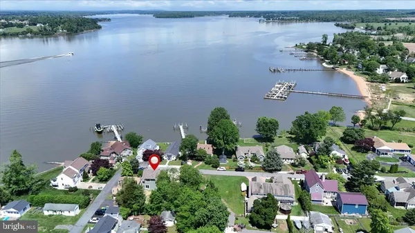 an aerial view of a house with a lake view
