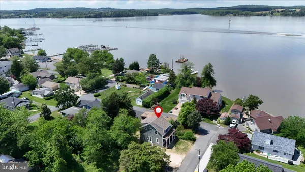an aerial view of house with yard