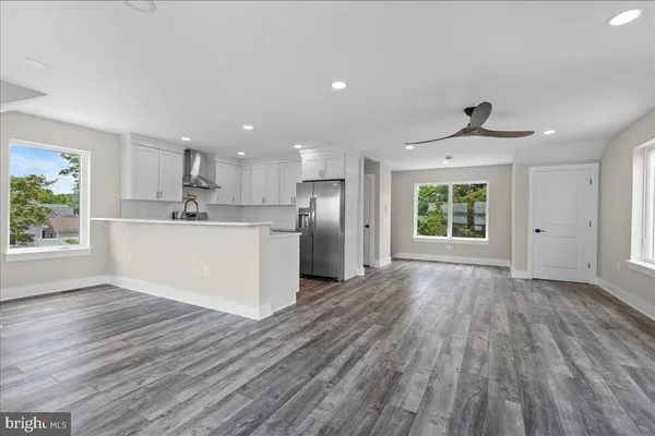 a view of a kitchen with a sink and a window