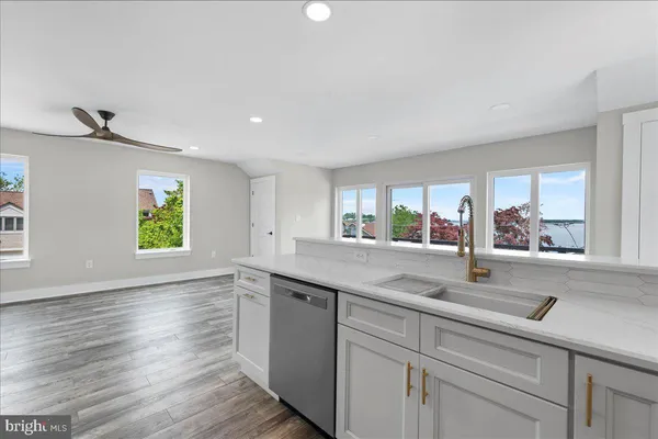 a kitchen with a sink and window