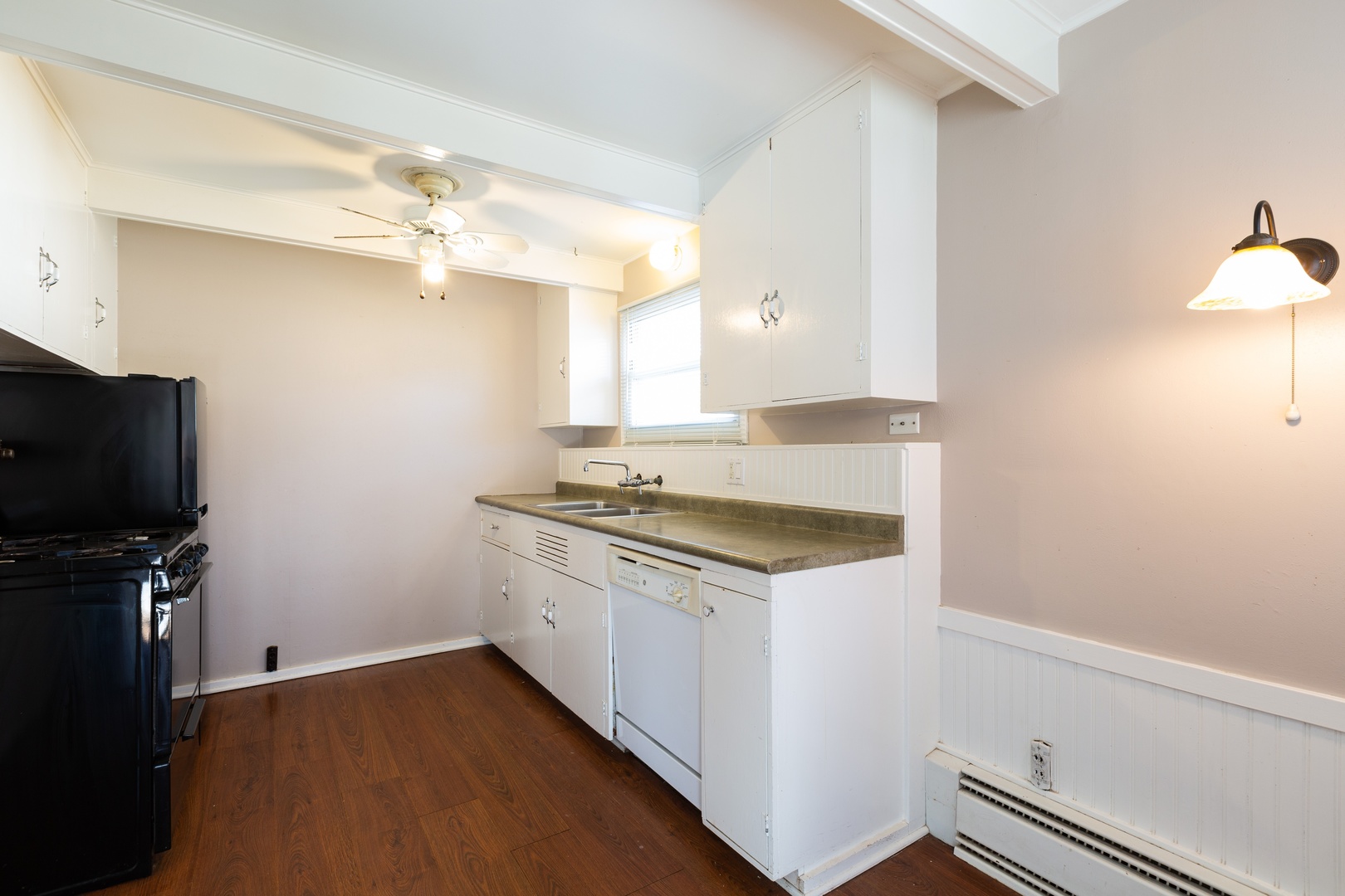 446 Golf Road Crystal Lake, IL 60014 - Photo 3 of 14 a kitchen with a stove and a microwave