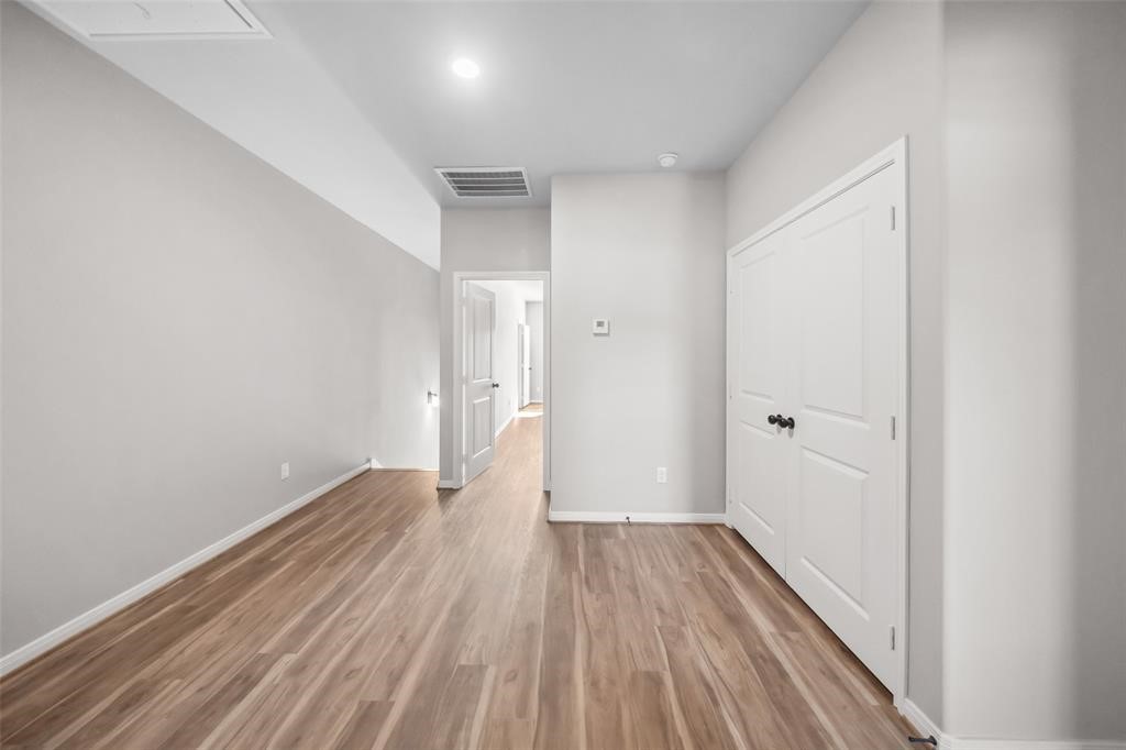 800 North Thompson Street Conroe, TX 77301 - Photo 14 of 25 a view of hallway with wooden floor