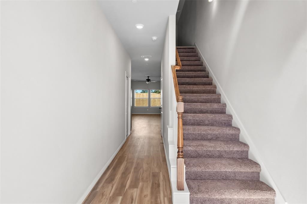 800 North Thompson Street Conroe, TX 77301 - Photo 2 of 25 a view of entryway and hall with wooden floor