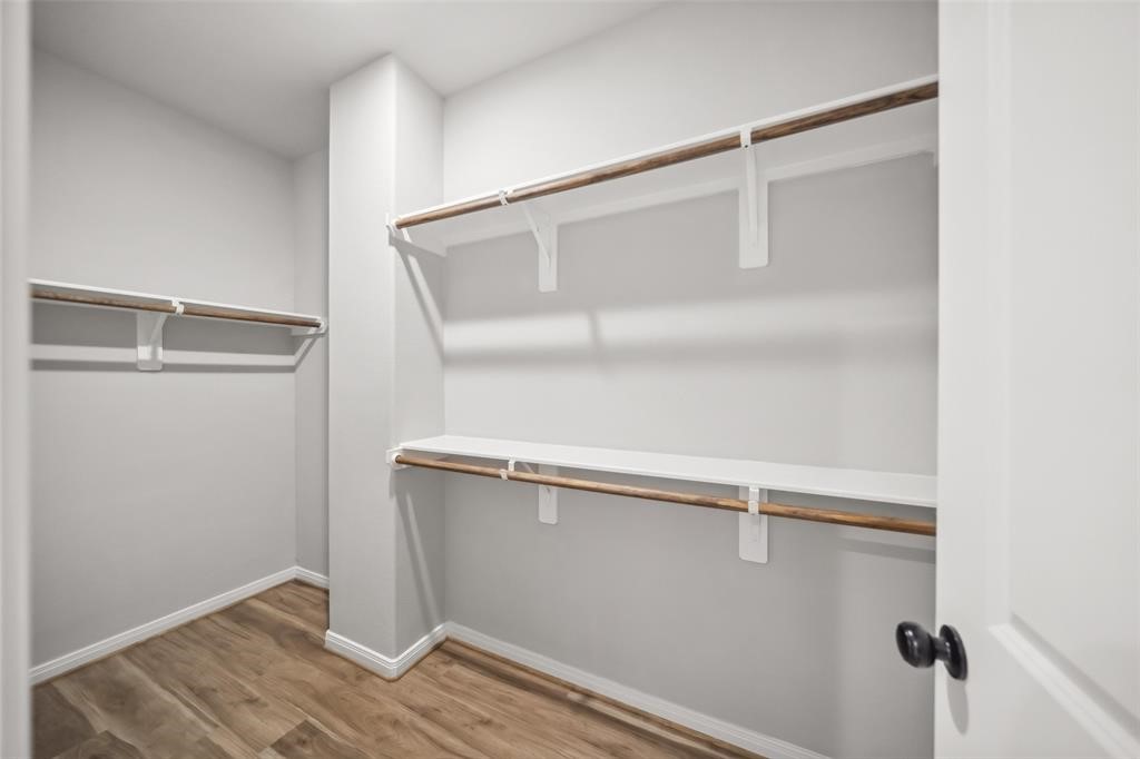 800 North Thompson Street Conroe, TX 77301 - Photo 21 of 25 a view of an empty walk in closet