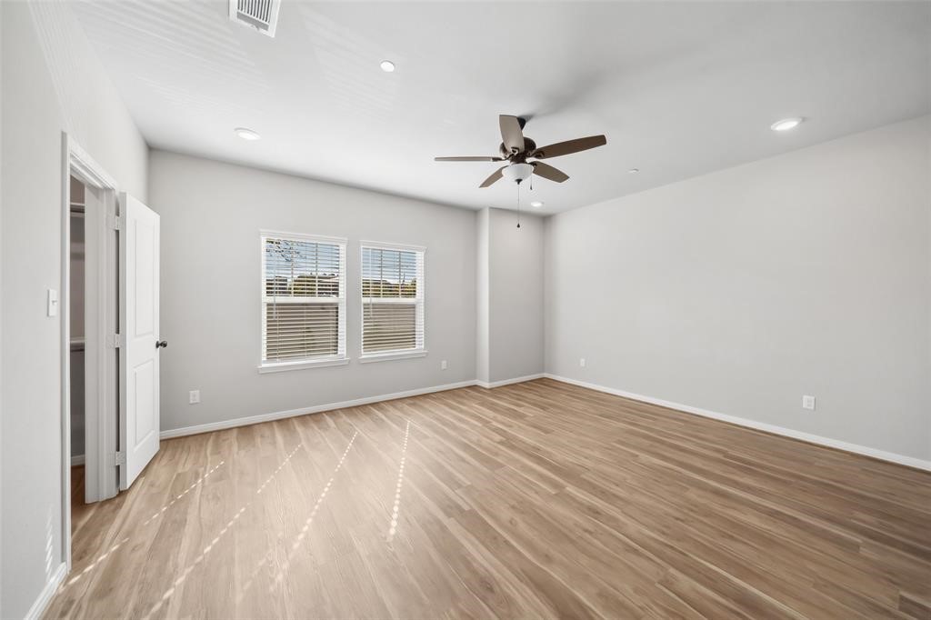 800 North Thompson Street Conroe, TX 77301 - Photo 25 of 25 a view of empty room with wooden floor and fan