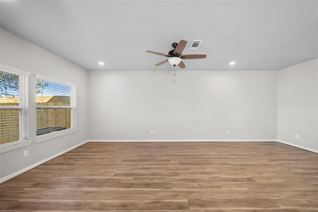 800 North Thompson Street Conroe, TX 77301 - Photo 5 of 25 a view of an empty room with a window
