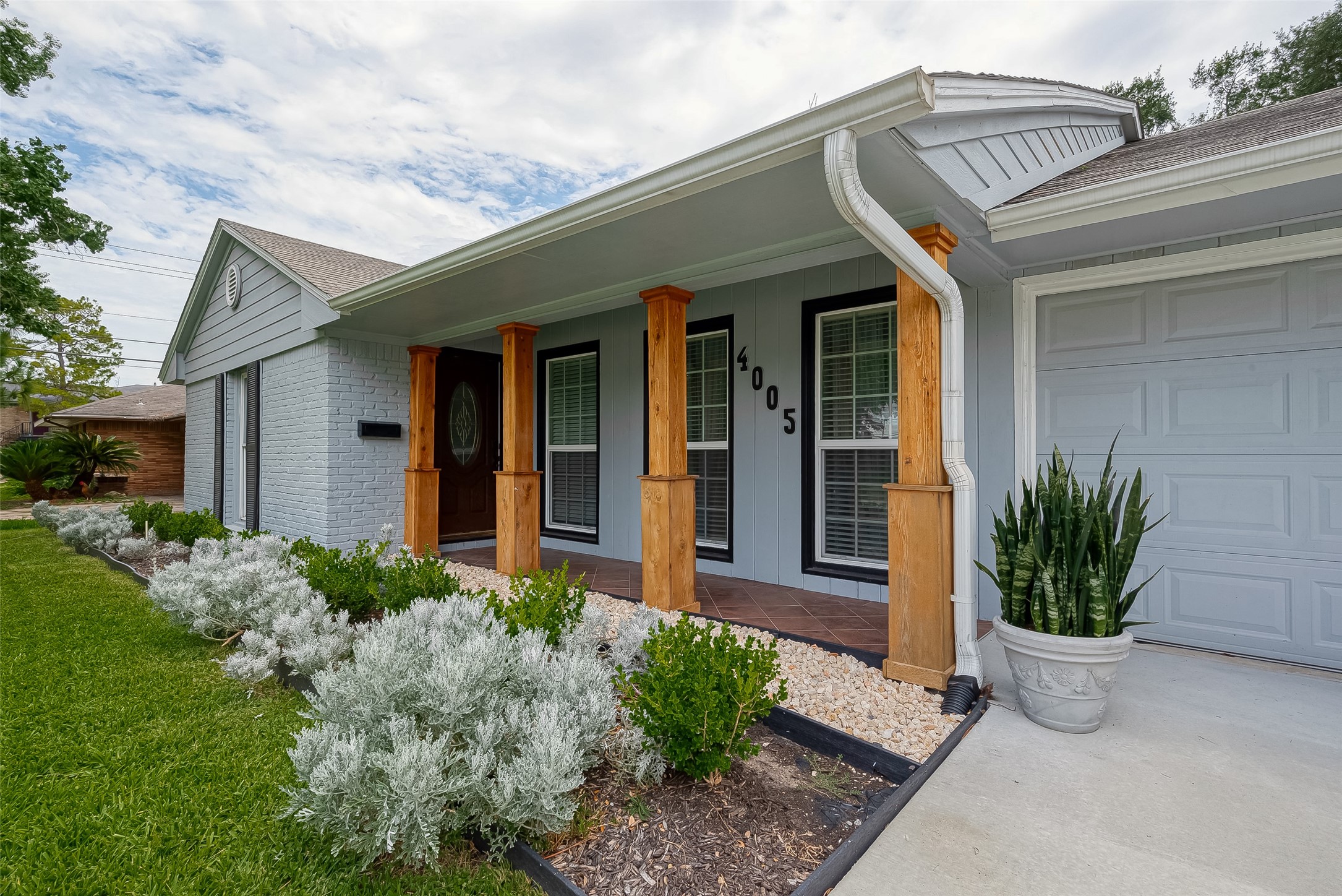 4005 Omeara Drive Houston, TX 77025 - Photo 1 of 49 a front view of a house with garden