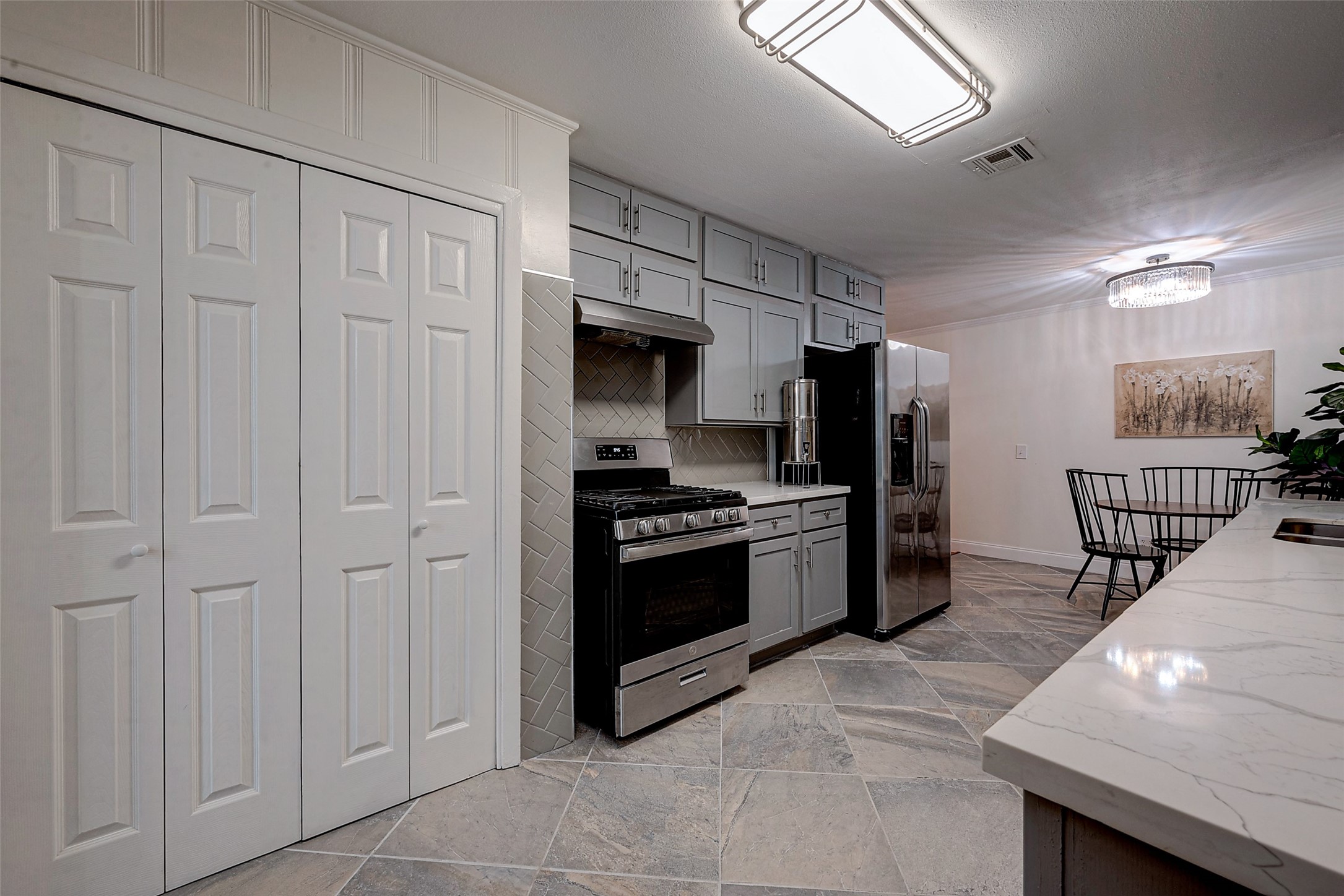 4005 Omeara Drive Houston, TX 77025 - Photo 11 of 49 a kitchen with stainless steel appliances granite countertop a refrigerator and a sink