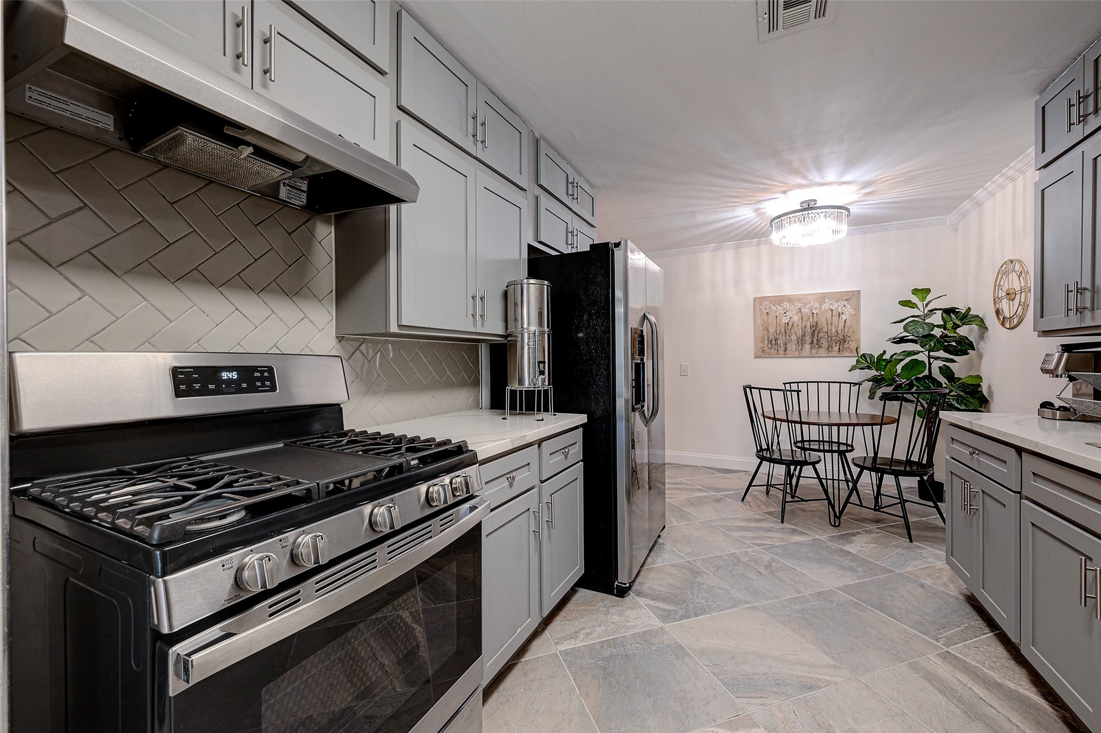 4005 Omeara Drive Houston, TX 77025 - Photo 12 of 49 a kitchen with stainless steel appliances granite countertop a stove a refrigerator and a stove