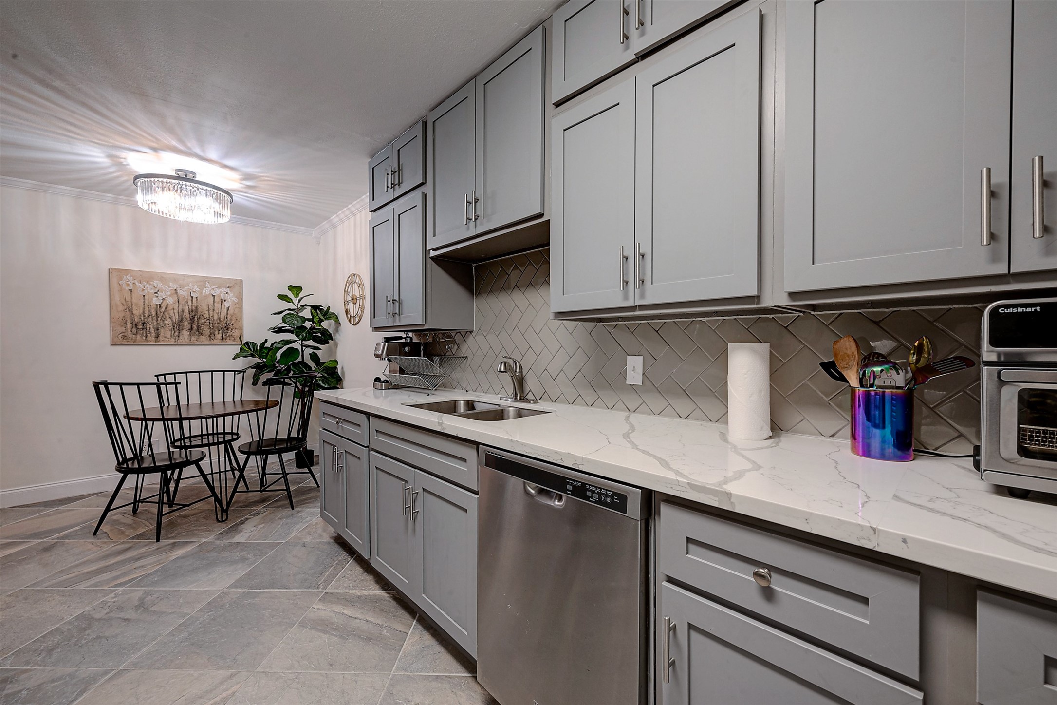 4005 Omeara Drive Houston, TX 77025 - Photo 13 of 49 a kitchen with stainless steel appliances granite countertop white cabinets a sink and dishwasher