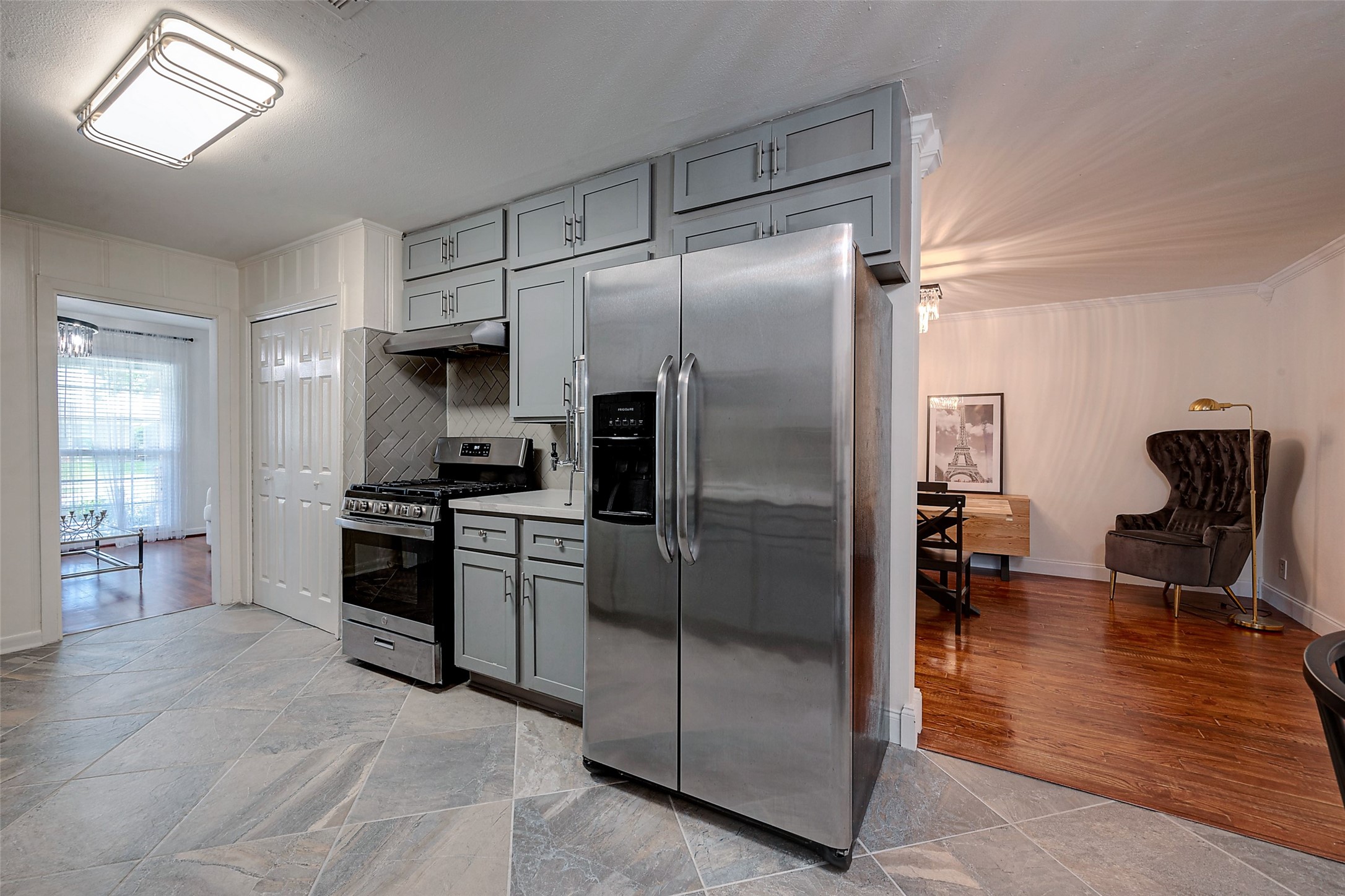 4005 Omeara Drive Houston, TX 77025 - Photo 14 of 49 a kitchen with granite countertop a refrigerator and a stove top oven