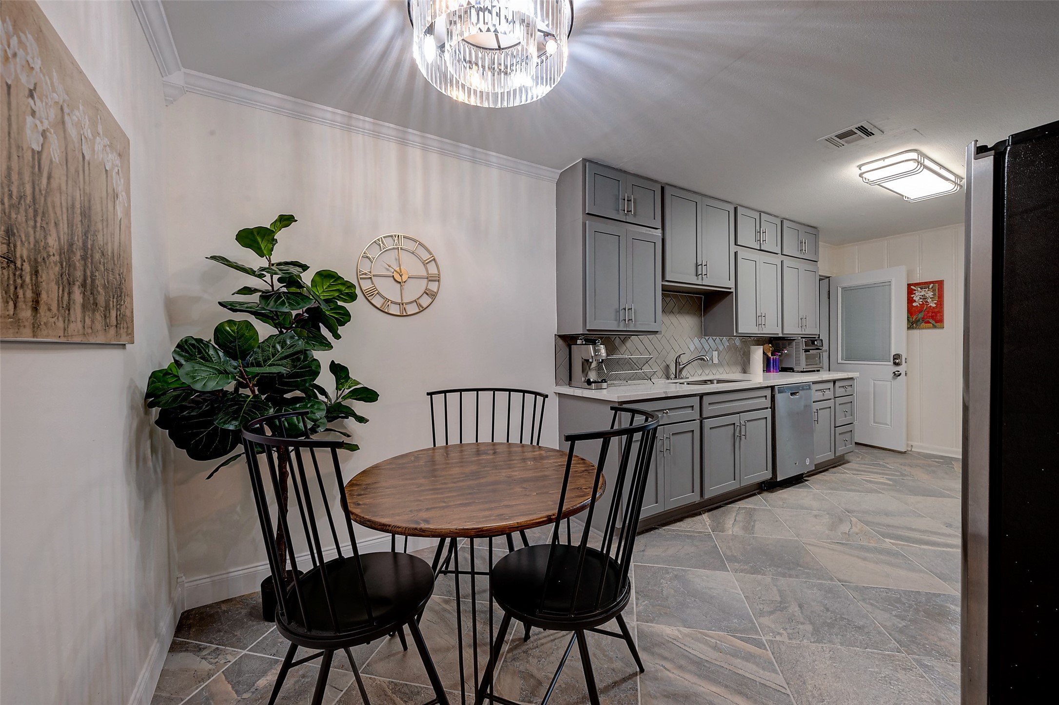 4005 Omeara Drive Houston, TX 77025 - Photo 17 of 49 a kitchen with a table and chairs in it