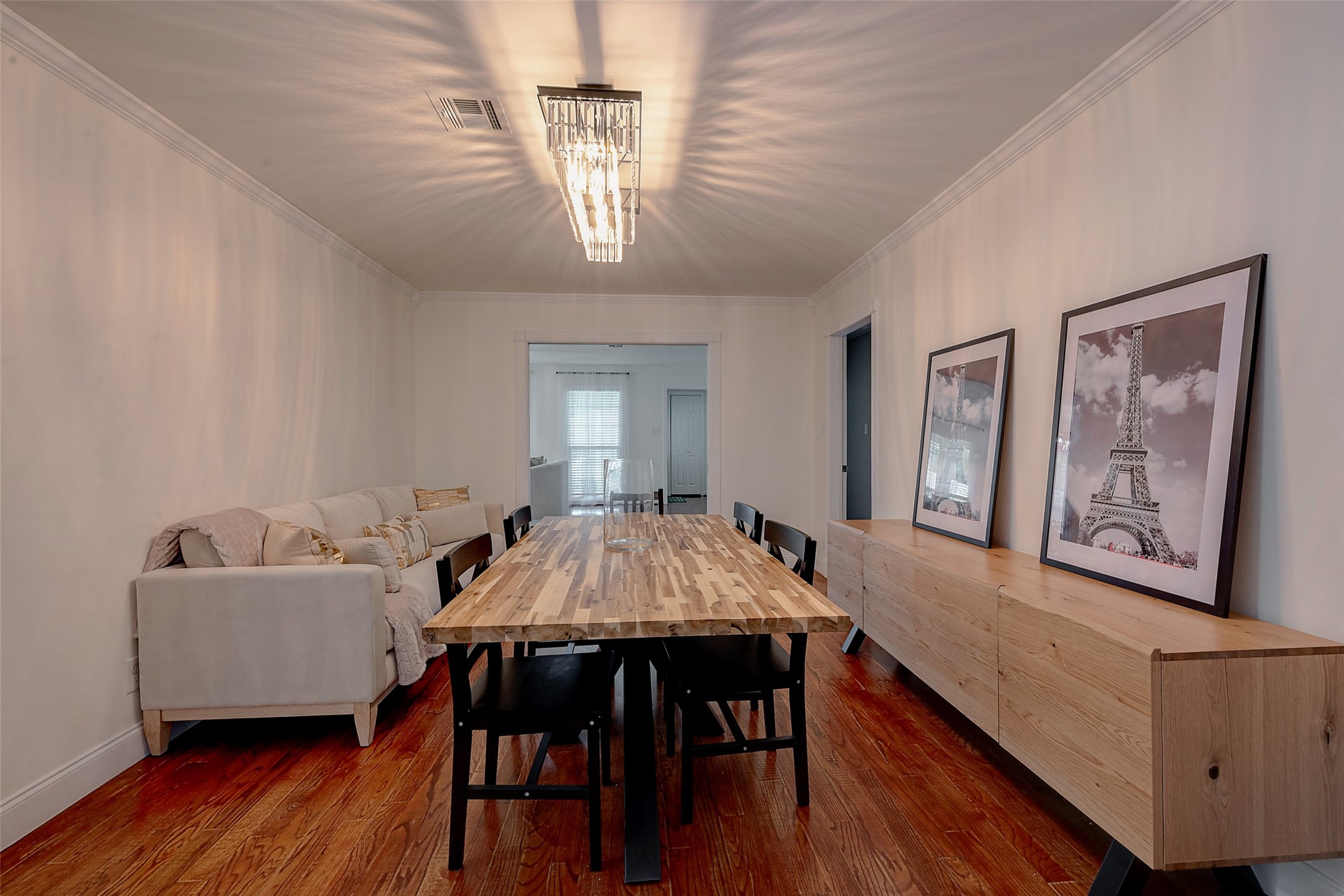 4005 Omeara Drive Houston, TX 77025 - Photo 20 of 49 a view of a dining room with furniture wooden floor and chandelier