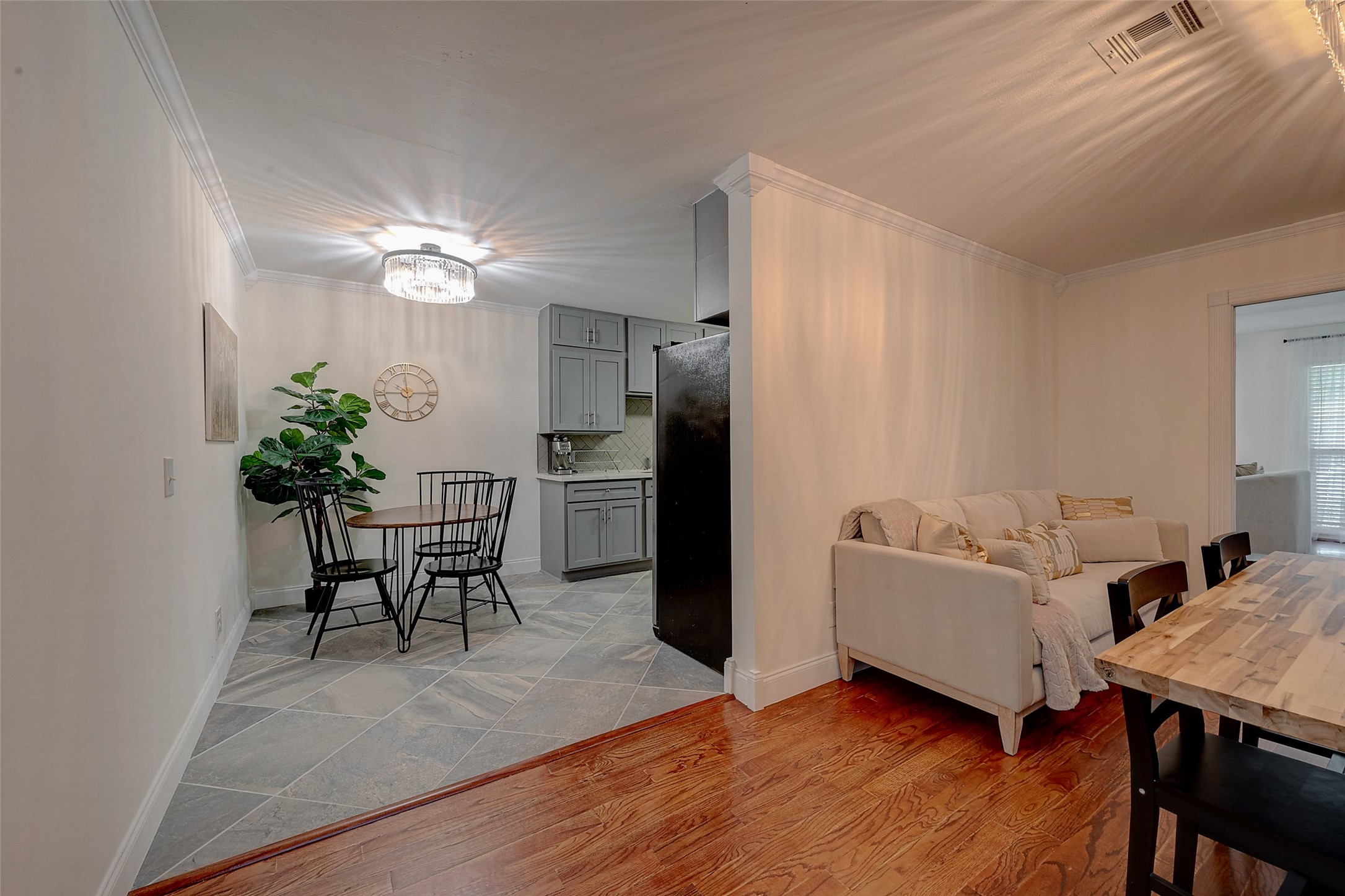 4005 Omeara Drive Houston, TX 77025 - Photo 22 of 49 a living room with furniture wooden floor and a chandelier