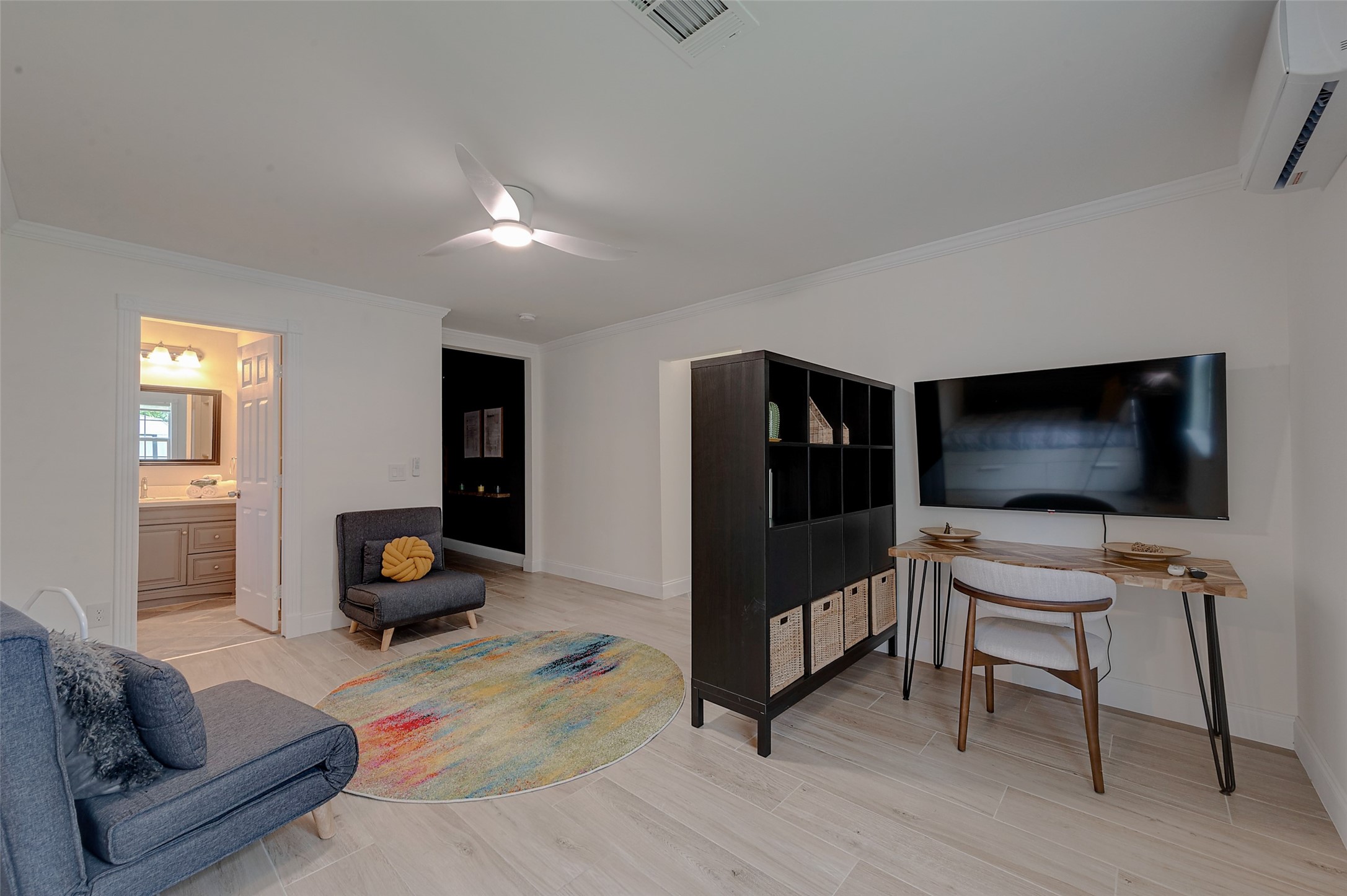 4005 Omeara Drive Houston, TX 77025 - Photo 32 of 49 a bedroom with furniture and a flat screen tv