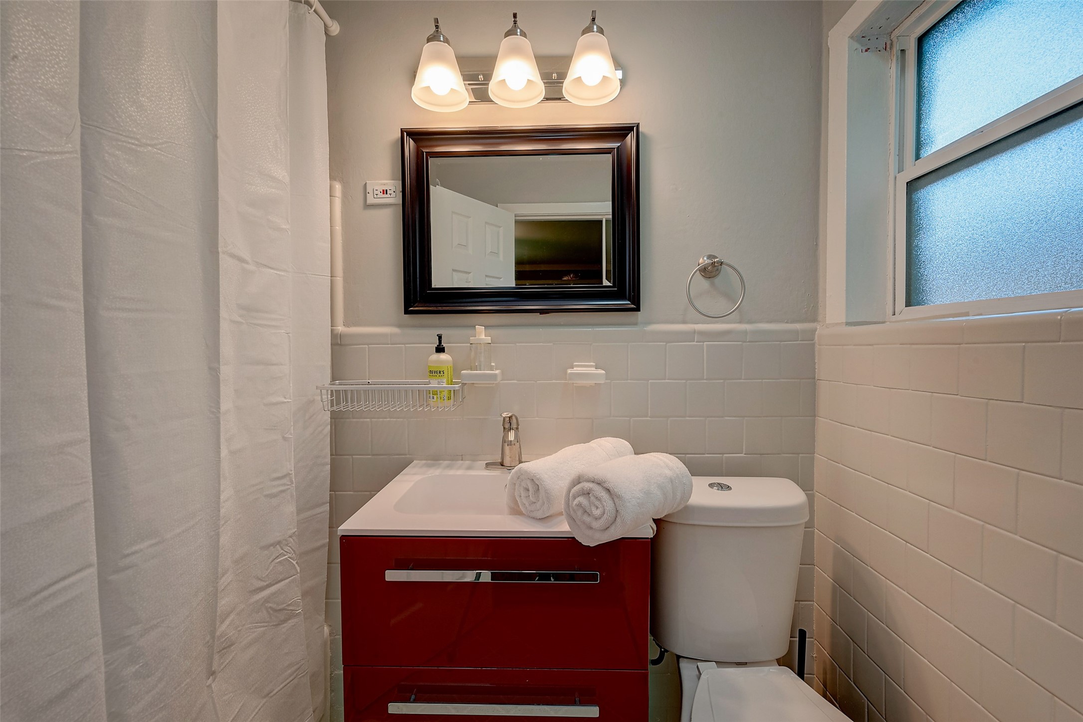 4005 Omeara Drive Houston, TX 77025 - Photo 38 of 49 a bathroom with a toilet sink and mirror