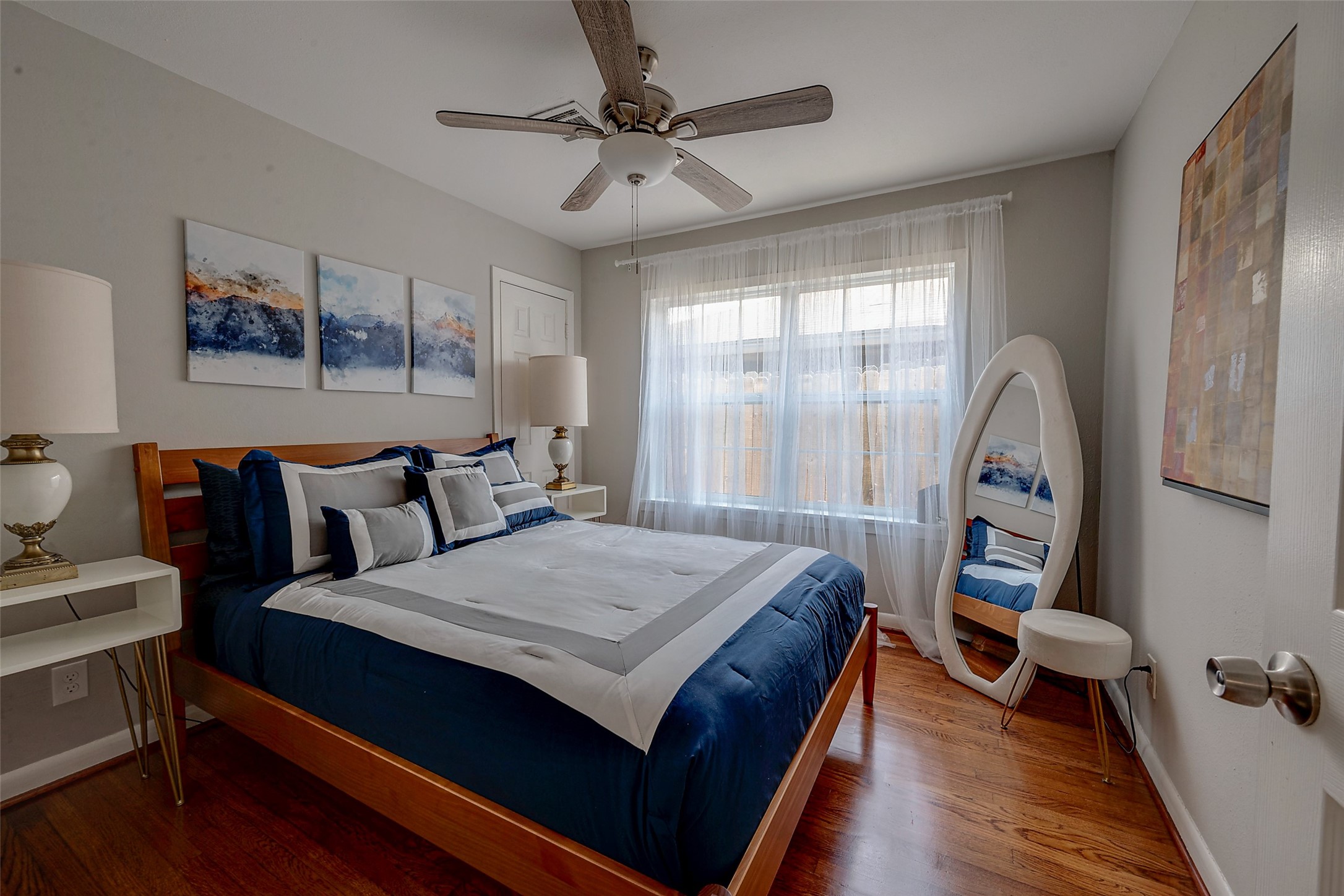 4005 Omeara Drive Houston, TX 77025 - Photo 43 of 49 a bed room with a bed and a chandelier