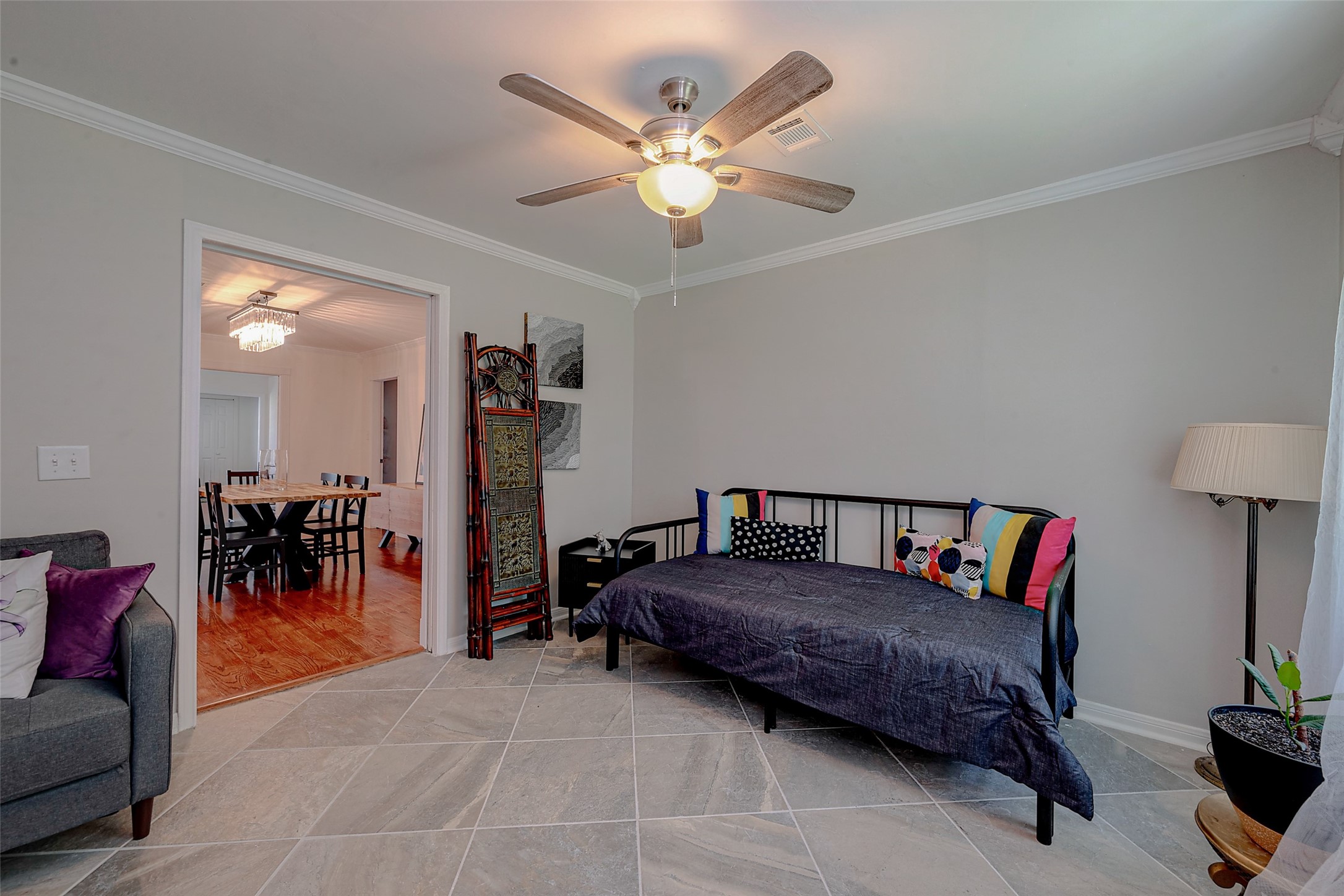 4005 Omeara Drive Houston, TX 77025 - Photo 45 of 49 a living room with furniture and a chandelier