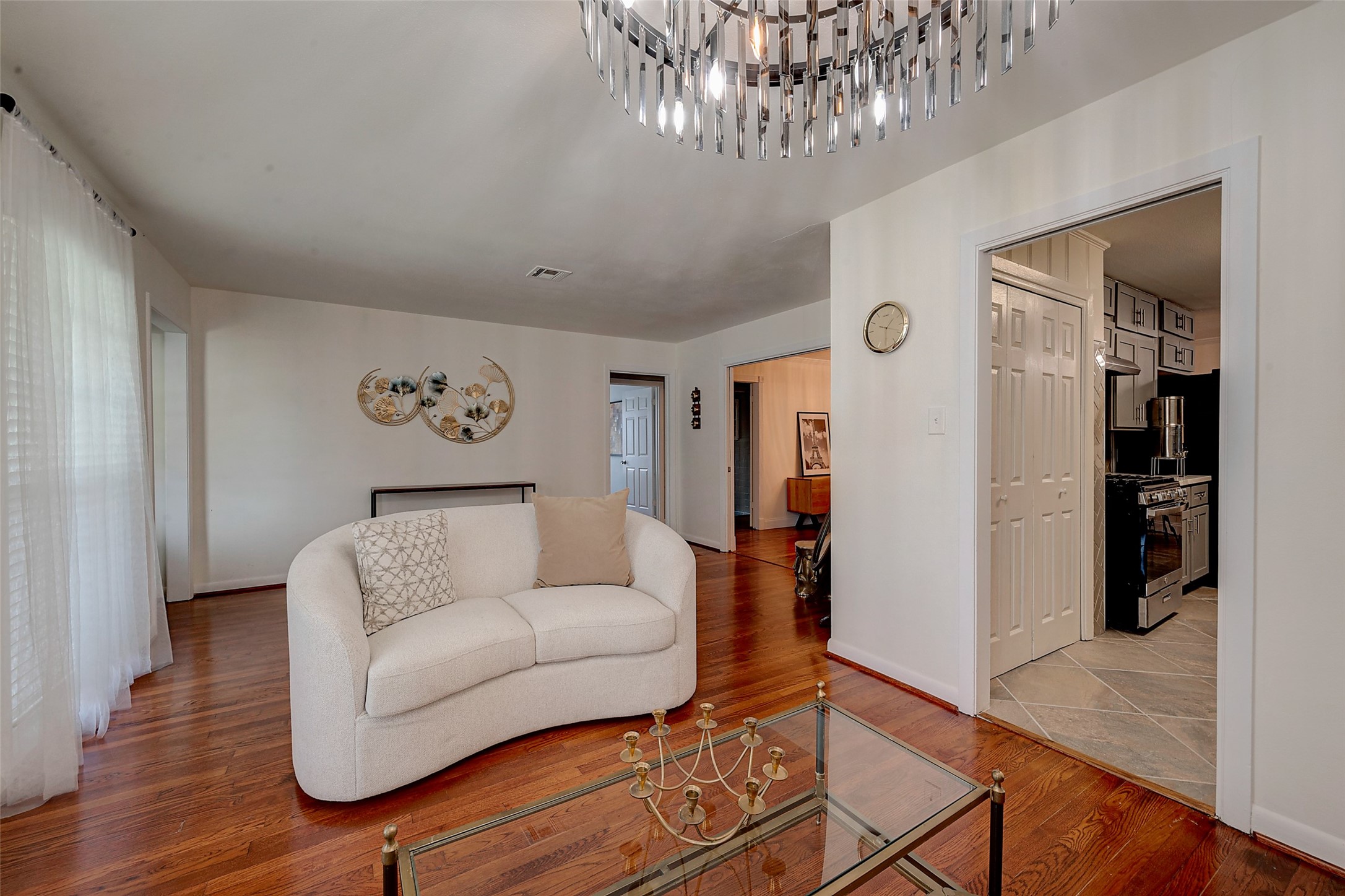 4005 Omeara Drive Houston, TX 77025 - Photo 8 of 49 a living room with furniture and a chandelier