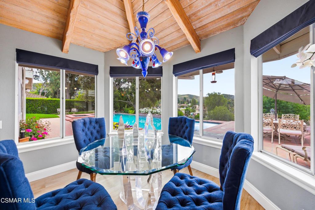206 Rangely Court Simi Valley, CA 93065 - Photo 15 of 63 a view of a dining room with furniture large windows and wooden floor