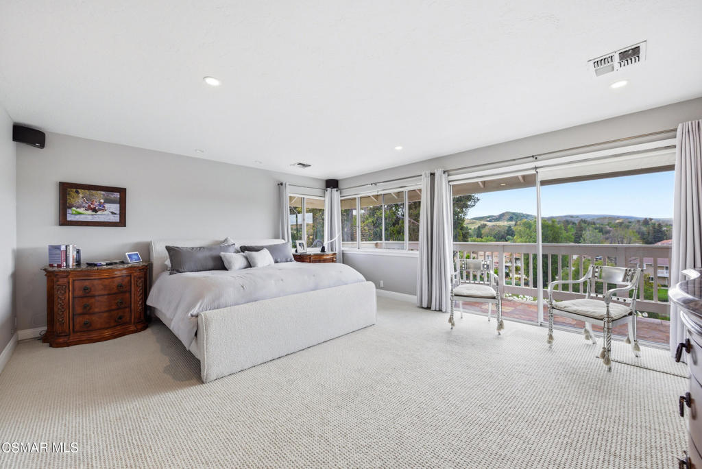 206 Rangely Court Simi Valley, CA 93065 - Photo 23 of 63 a spacious bedroom with a bed and a couch