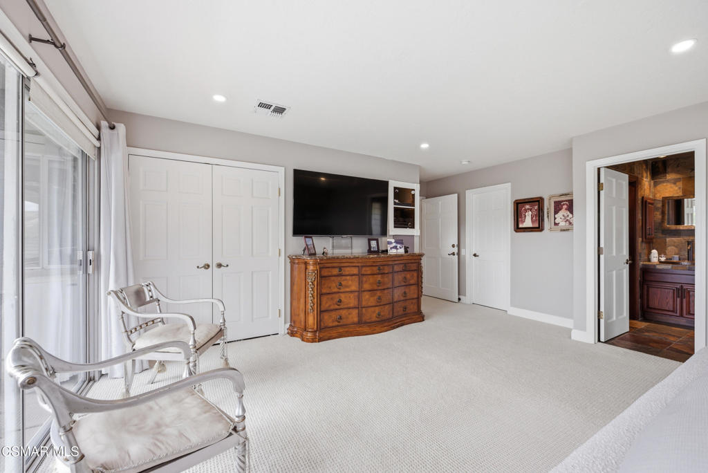 206 Rangely Court Simi Valley, CA 93065 - Photo 24 of 63 a living room with furniture and a flat screen tv