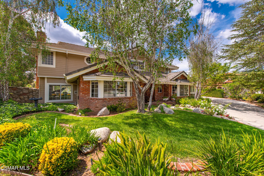 206 Rangely Court Simi Valley, CA 93065 - Photo 5 of 63 a front view of a house with a yard